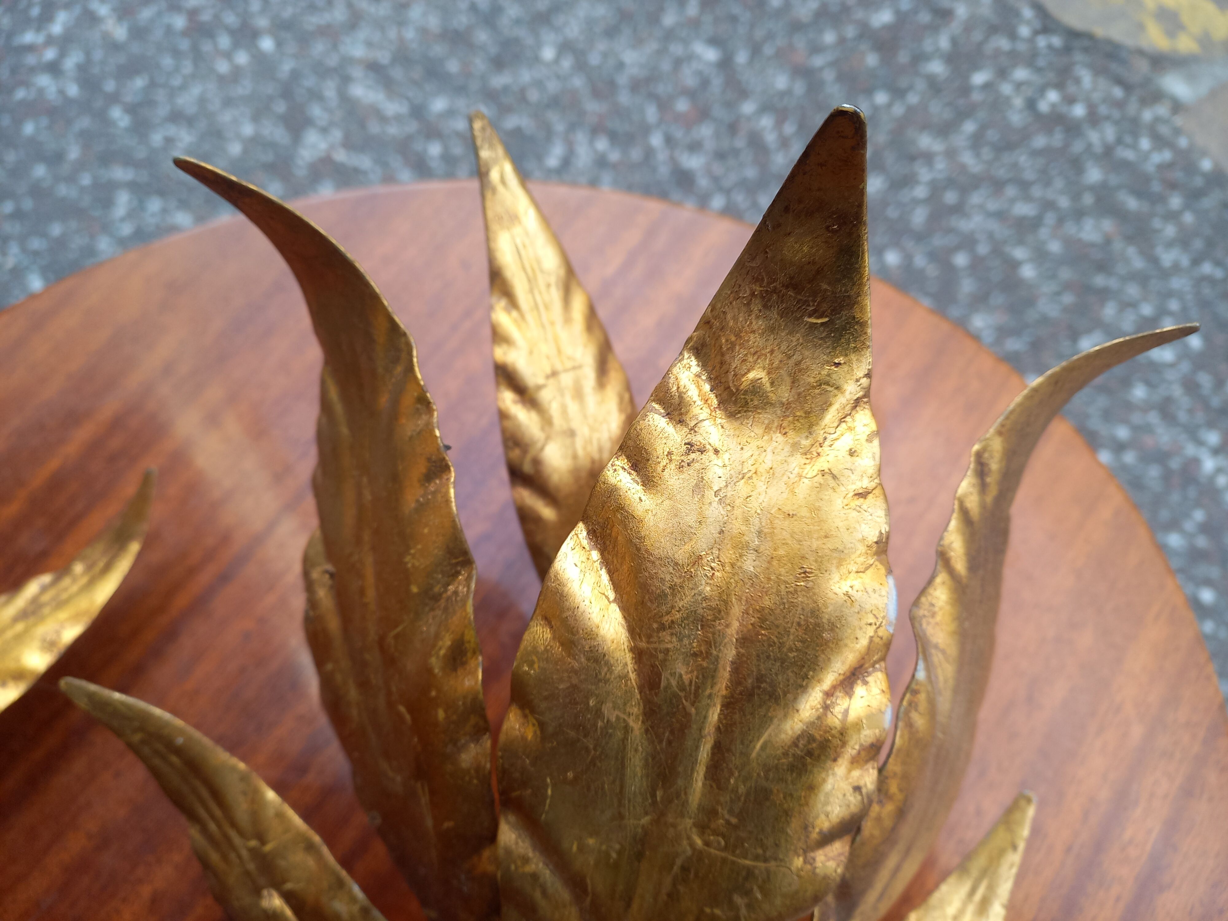 Pair of gold leaf sconces