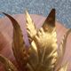 Pair of gold leaf sconces