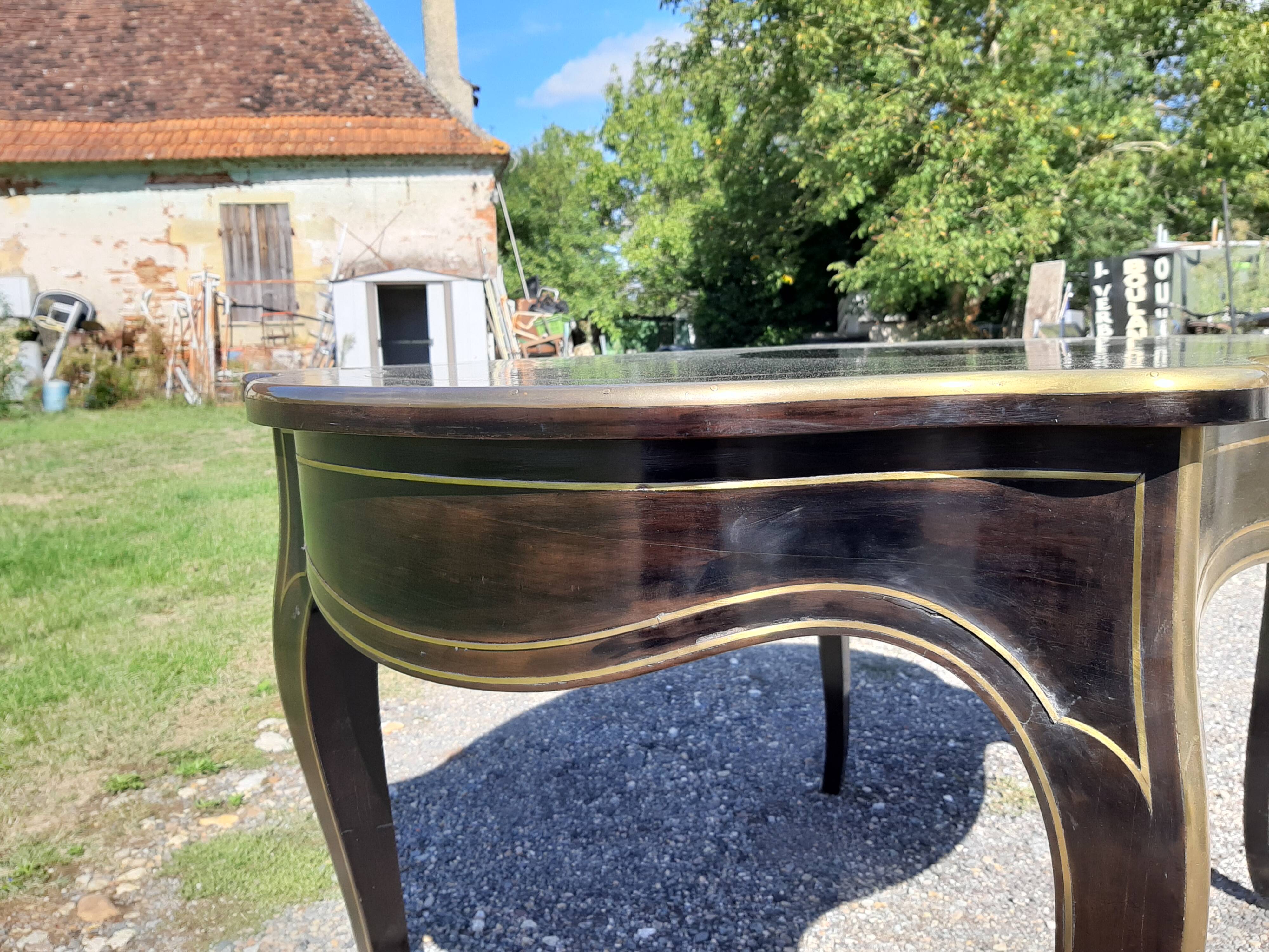 Napoleon III black lacquered wood and brass table