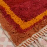 Minimalist burgundy cherry red shaggy berber rug