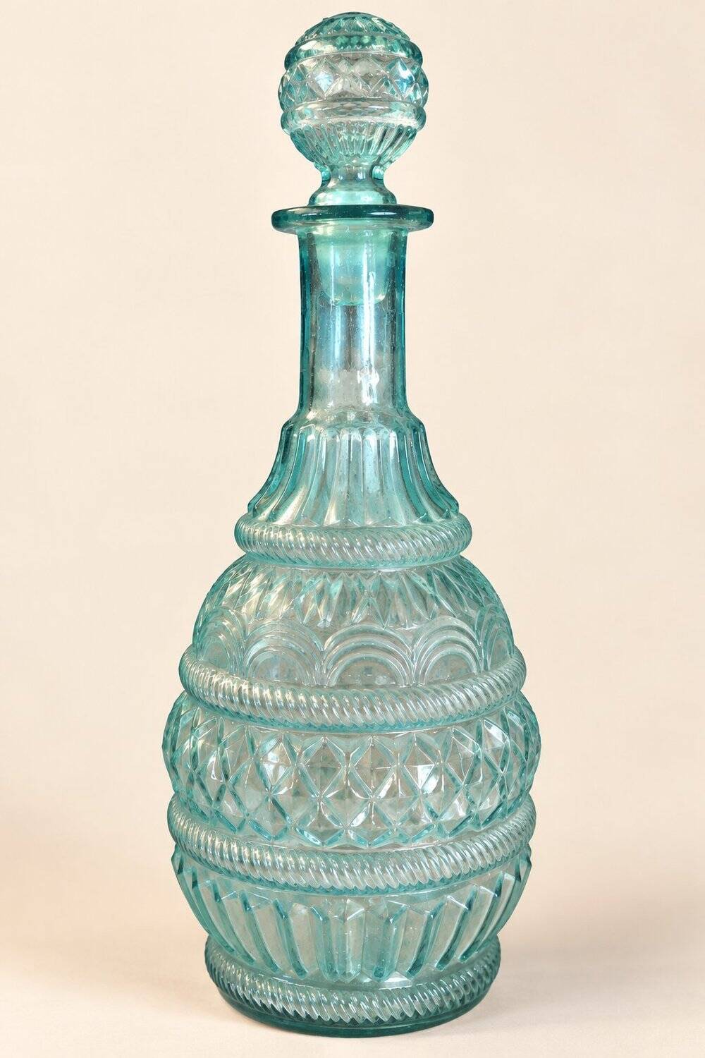 Pair of cut blown glass carafes in blue-green from the 19th century.