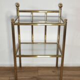 Bedside table in brass and glass.