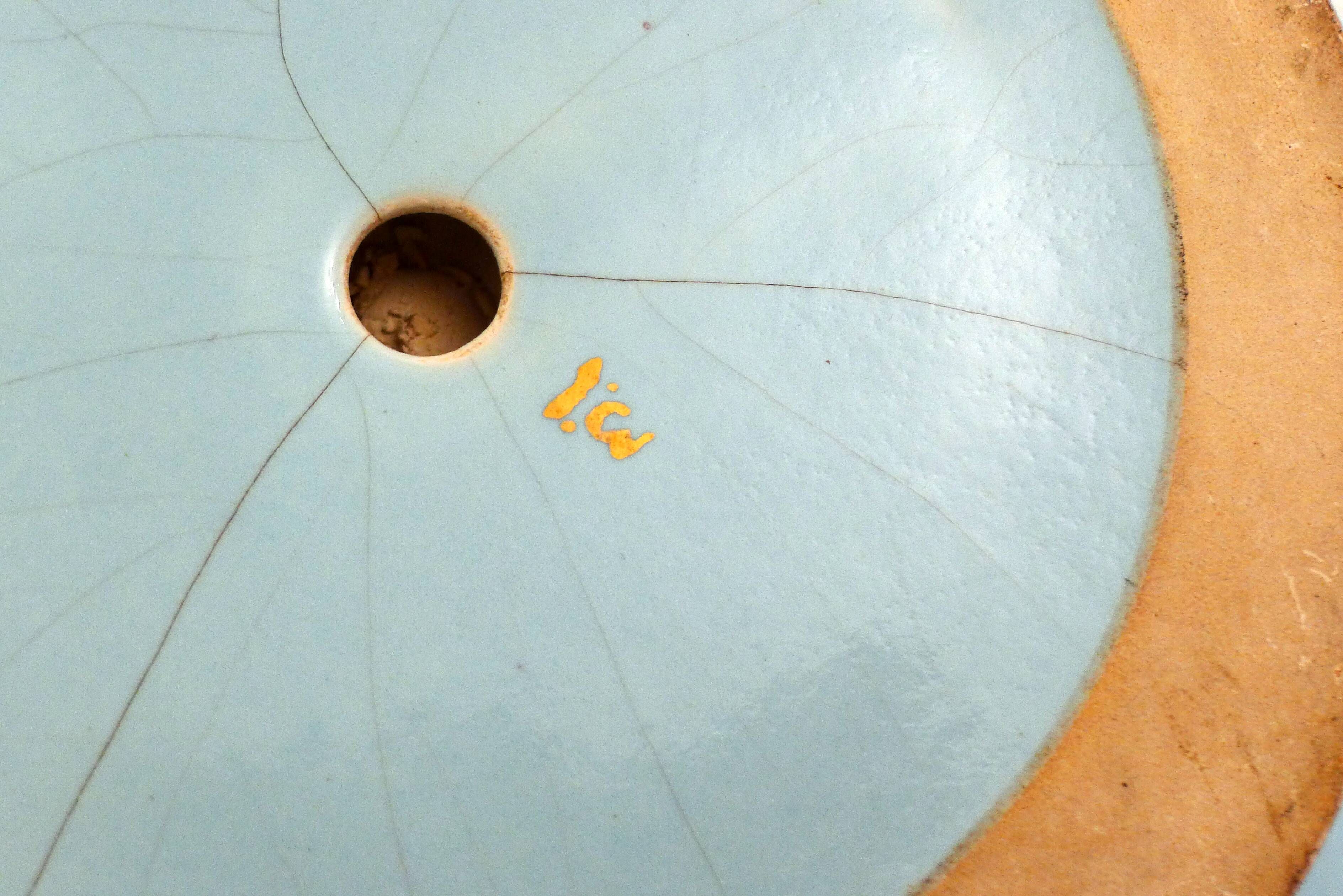 Art Deco modernist coupe, with a base of 3 spheres, in turquoise ceramic and gilding.