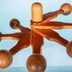Minimalist organic coat rack in pine from the 1970s in space age style.