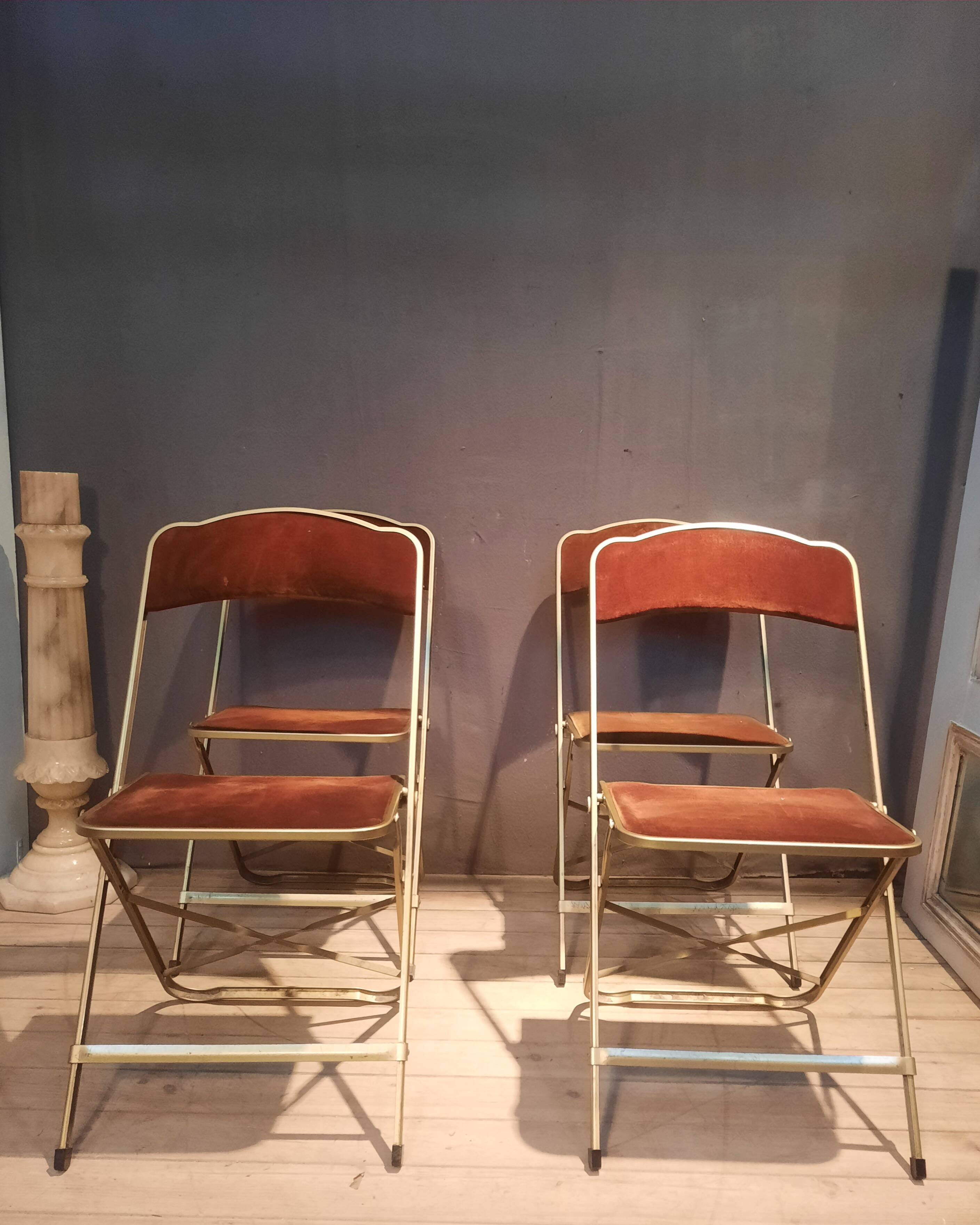 Set of four folding metal and velvet chairs