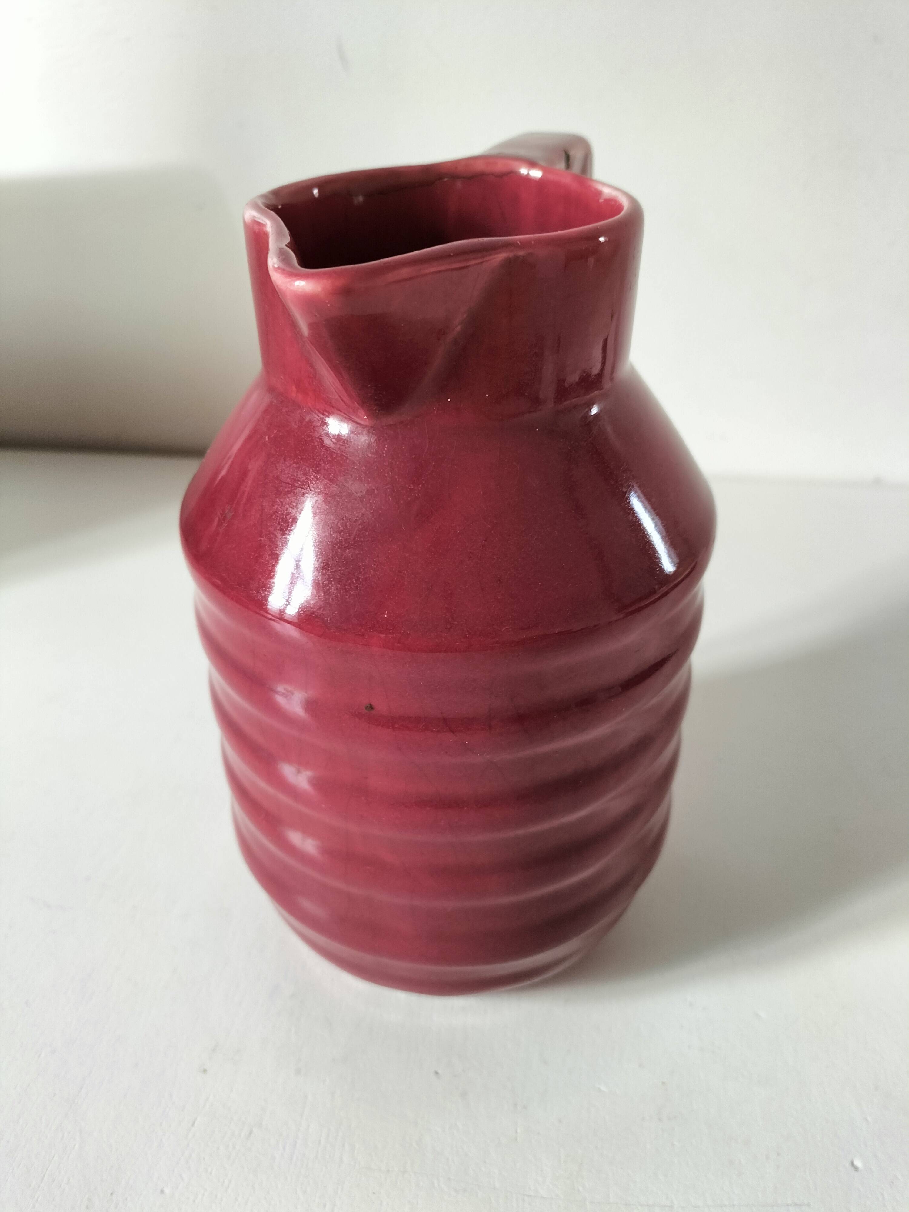 Old raspberry red pitcher from Onnaing, early 20th century.
