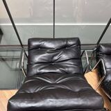 Pair of vintage armchairs in black imitation leather and chrome metal, France 1970