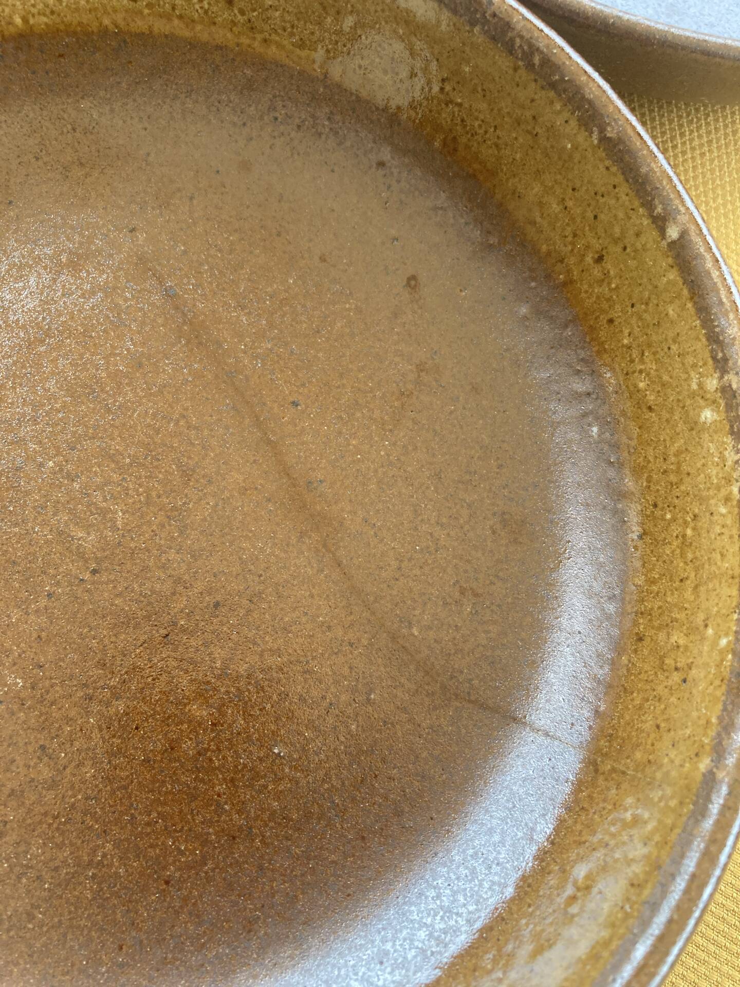 Deep plates made of organic, wild, earthy marsh clay.