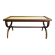 Patinated and gilded carved wooden coffee table. Hirch House.