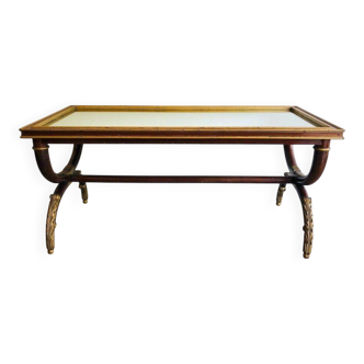 Patinated and gilded carved wooden coffee table. Hirch House.