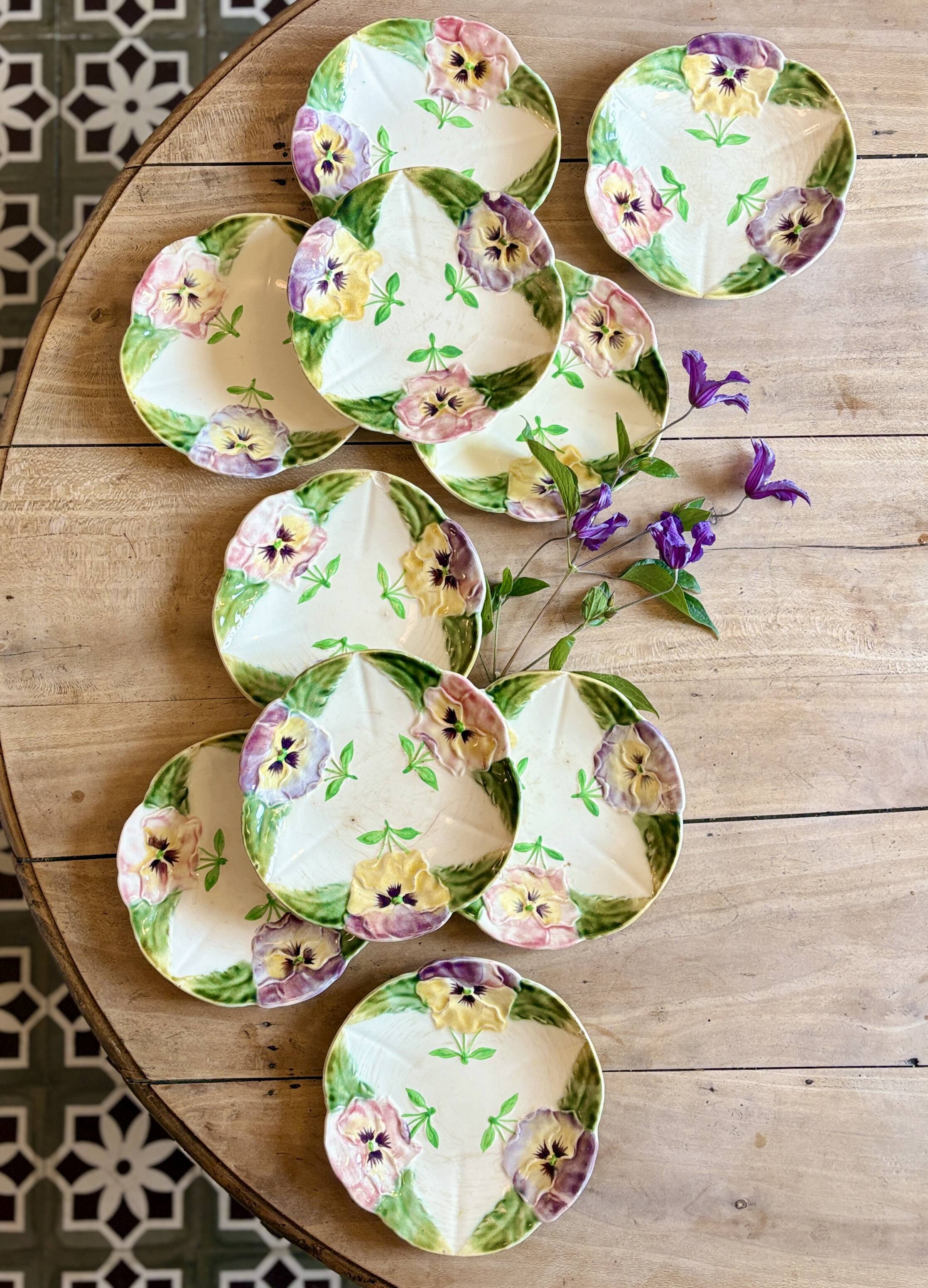 Set of 10 antique slip plates with flower decorations