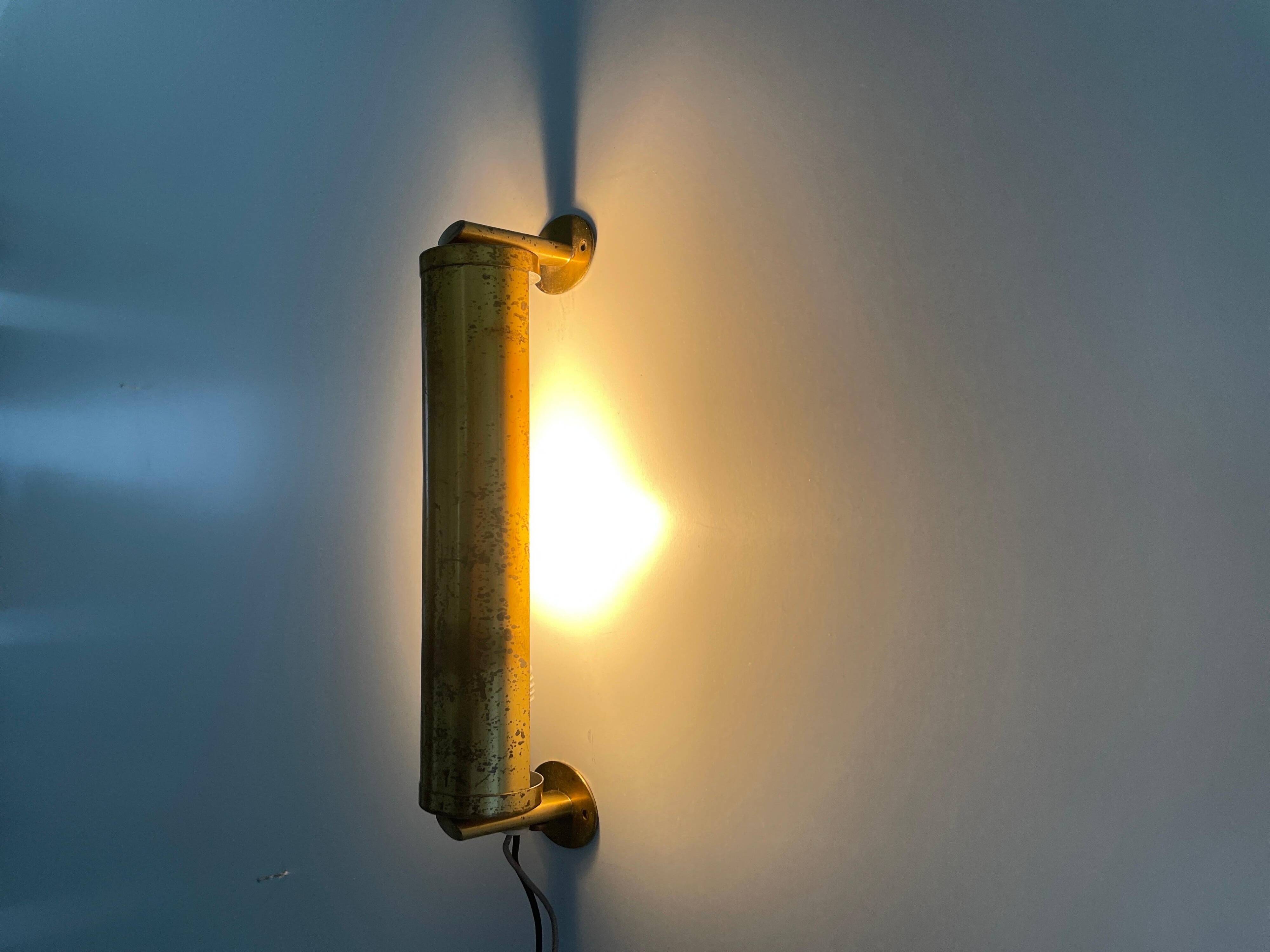 Small simple cylindrical brass wall light from the mid-century, 1950s, Germany.