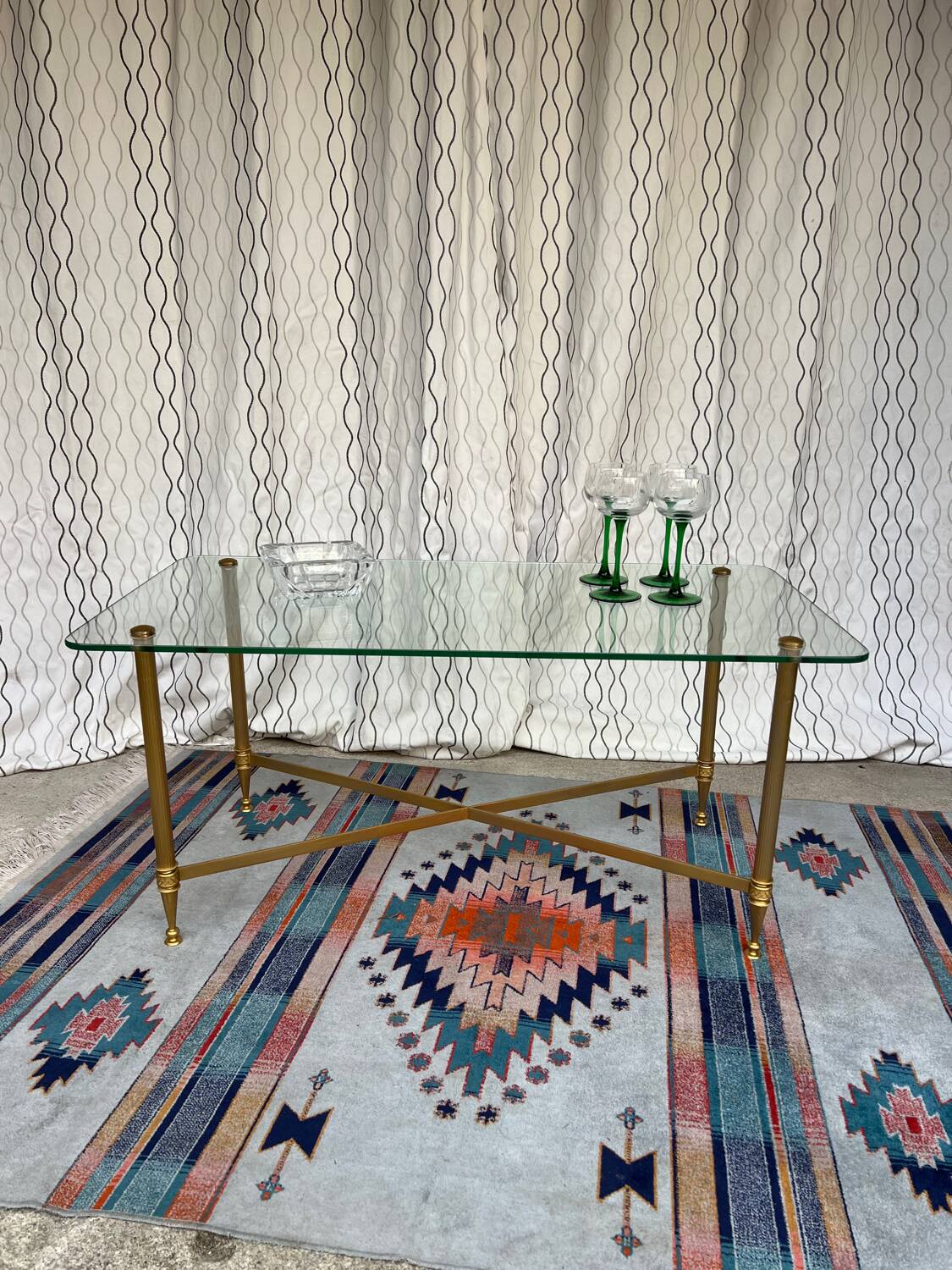 Vintage gold coffee table. Glass top.
