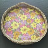 Top of the 60s in rattan braid wood bottom covered with a plastic with pink and yellow flower