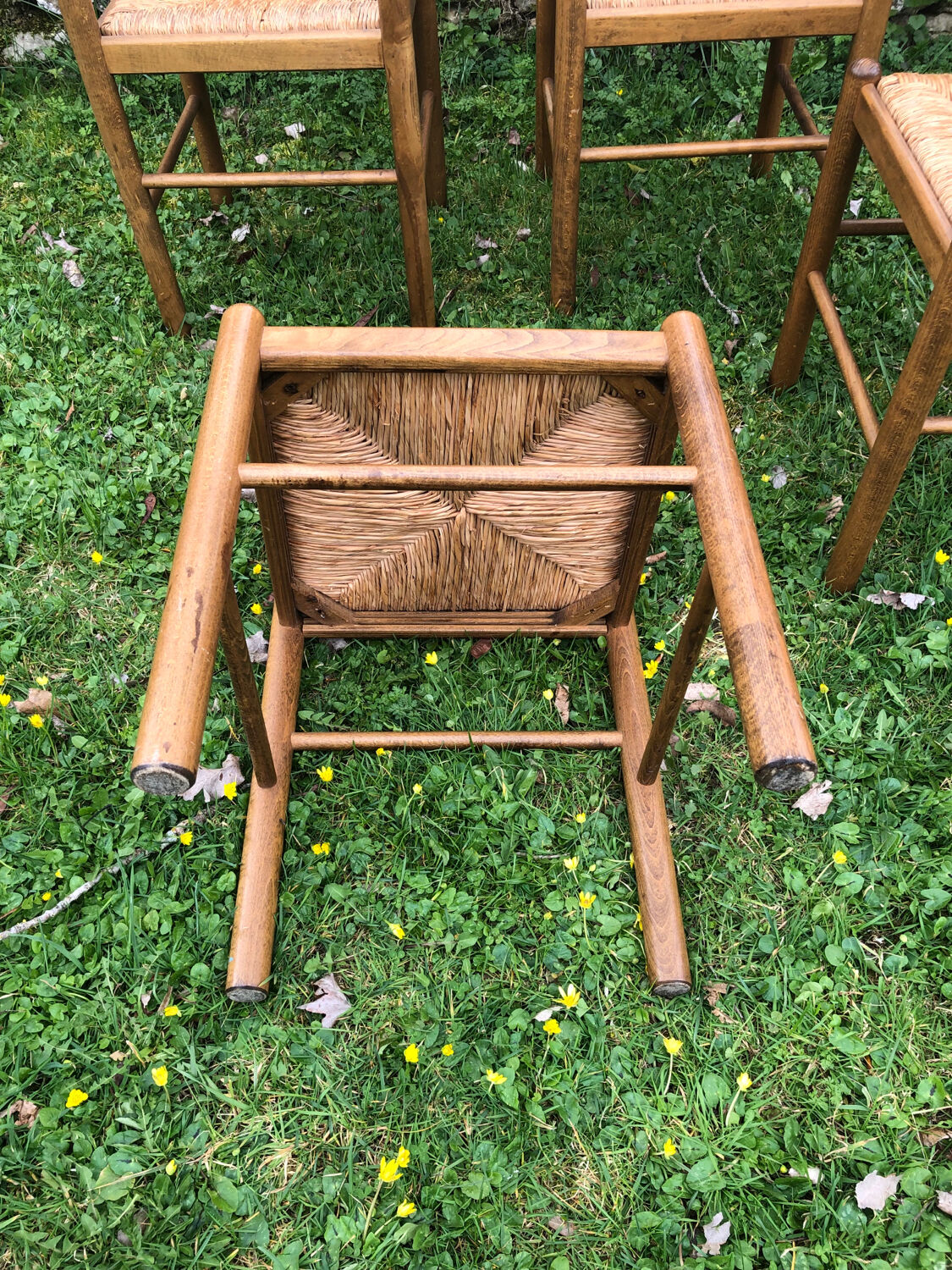 4 wood and straw chairs
