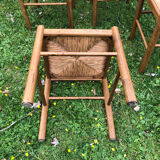 4 wood and straw chairs