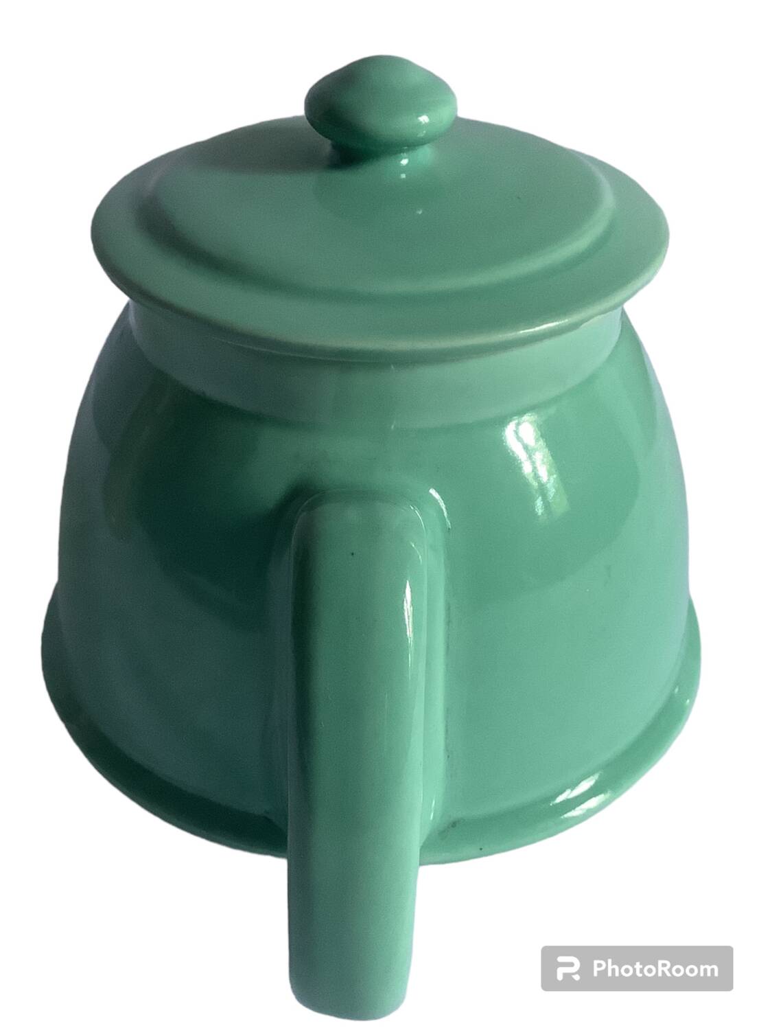 Old green ceramic teapot