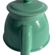 Old green ceramic teapot