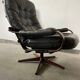 Scandinavian swivel lounge chair in black leather with a bent wood frame, 1970s.