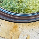 Vintage round smoked plastic mirror, circa 1970s.