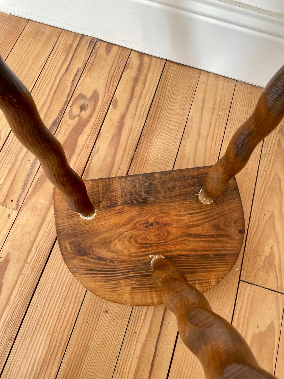 Vintage wooden half-moon tripod stool with twisted legs