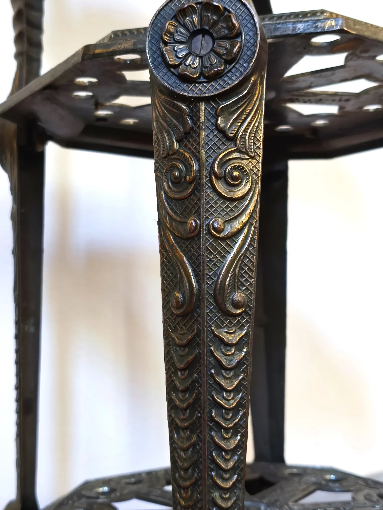 Italian side table with three openwork shelves in patinated metal.