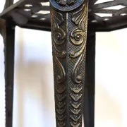 Italian side table with three openwork shelves in patinated metal.