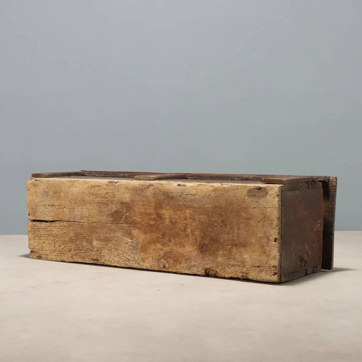 Antique walnut chest with a hinged lid, Italy, 17th century.