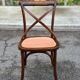 4 bistro chairs with curved wooden backs and cross braces / Crossback