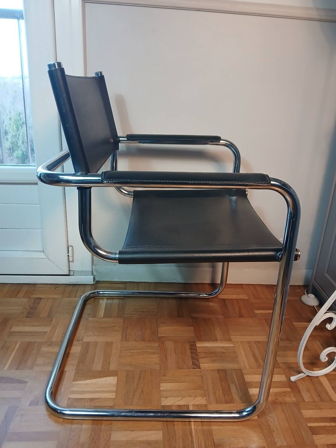 Black leather cantilever chair with chrome steel – Modernist design