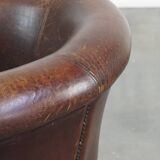 Sheep leather club chair finished with decorative nails