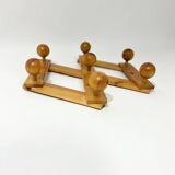 Accordion wall coat rack in solid pine