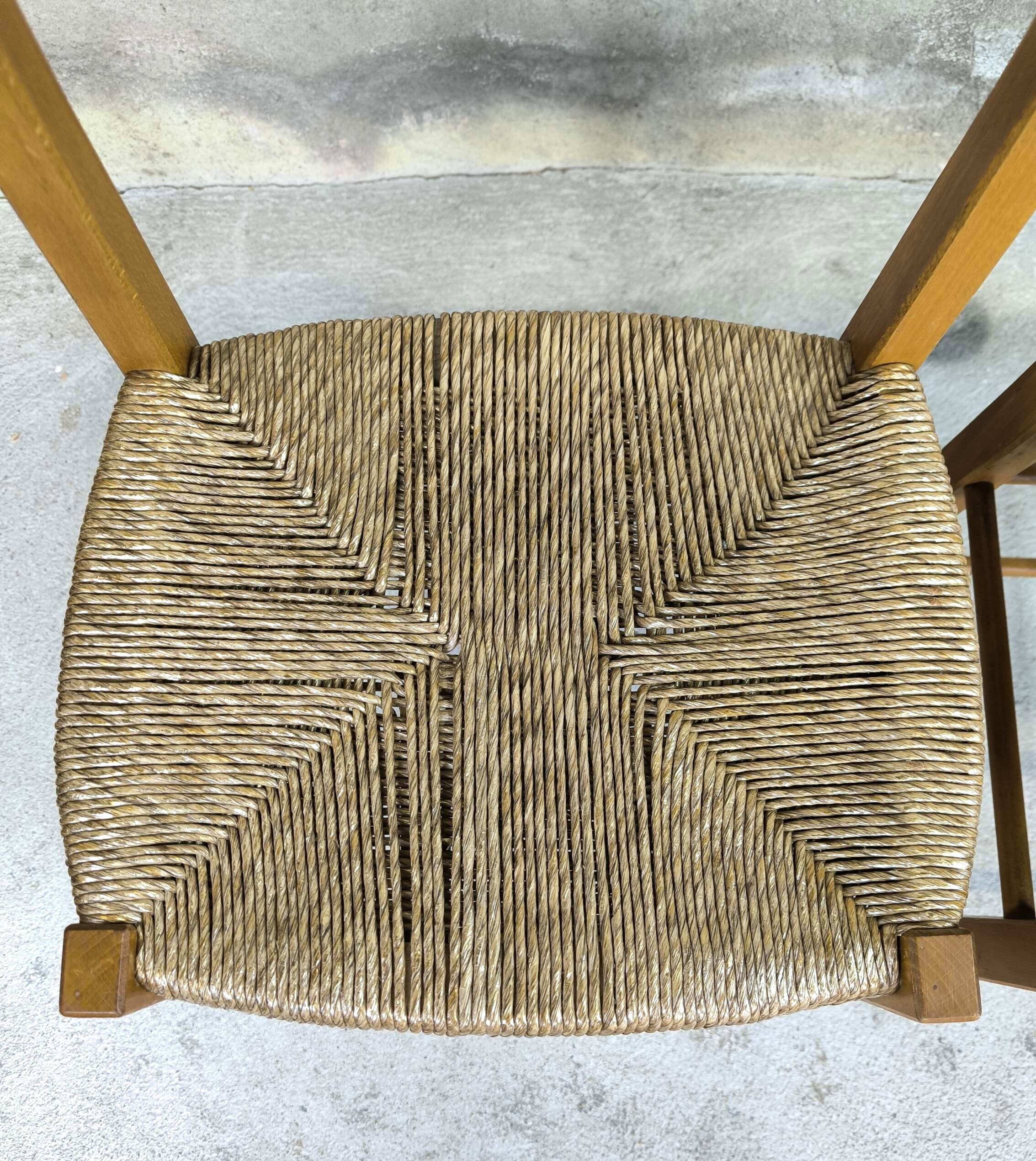 Pair of vintage wood and straw chairs