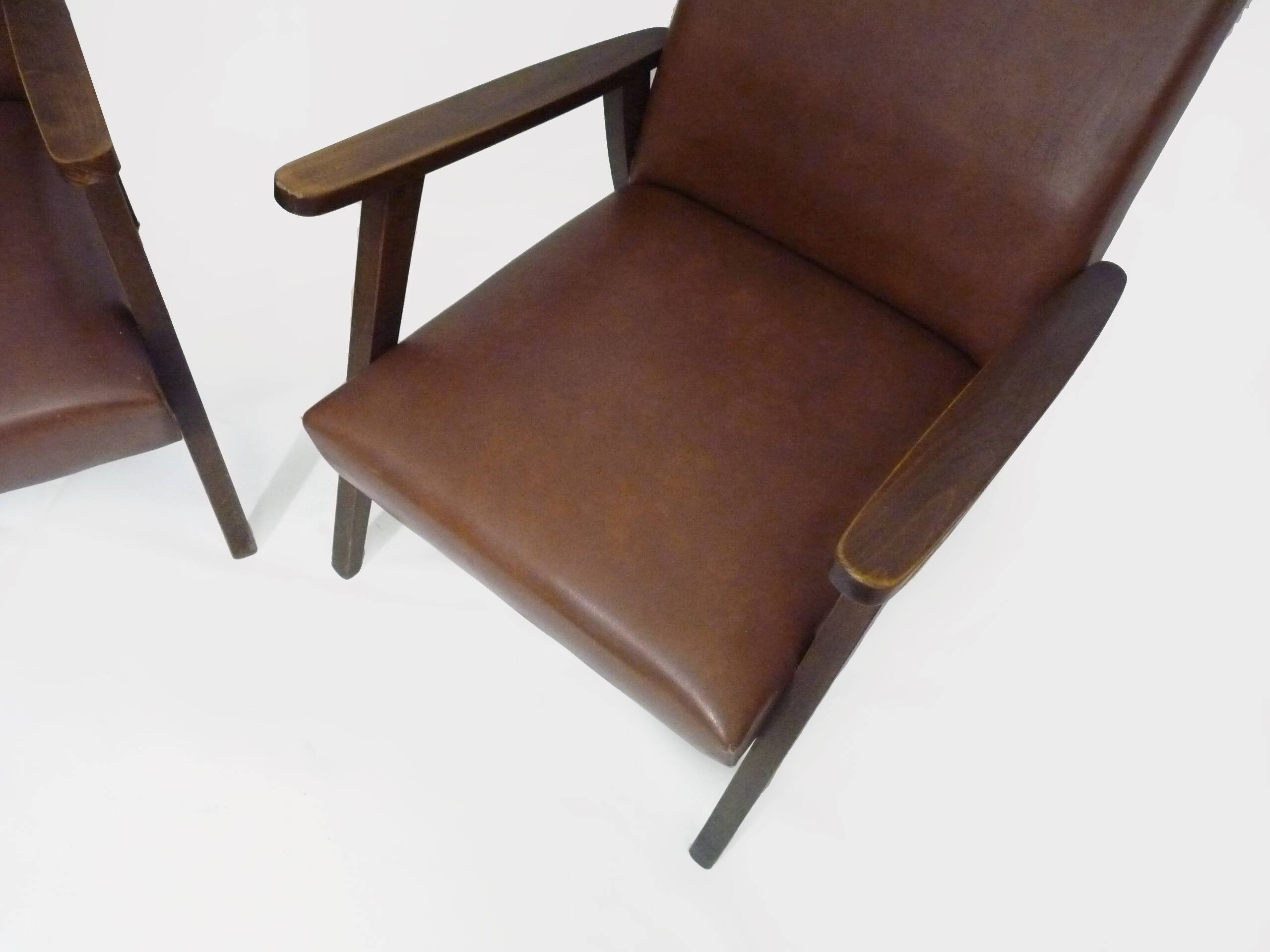 Pair of Scandinavian armchairs in brown leatherette and wood from the 50s and 60s