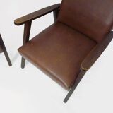 Pair of Scandinavian armchairs in brown leatherette and wood from the 50s and 60s