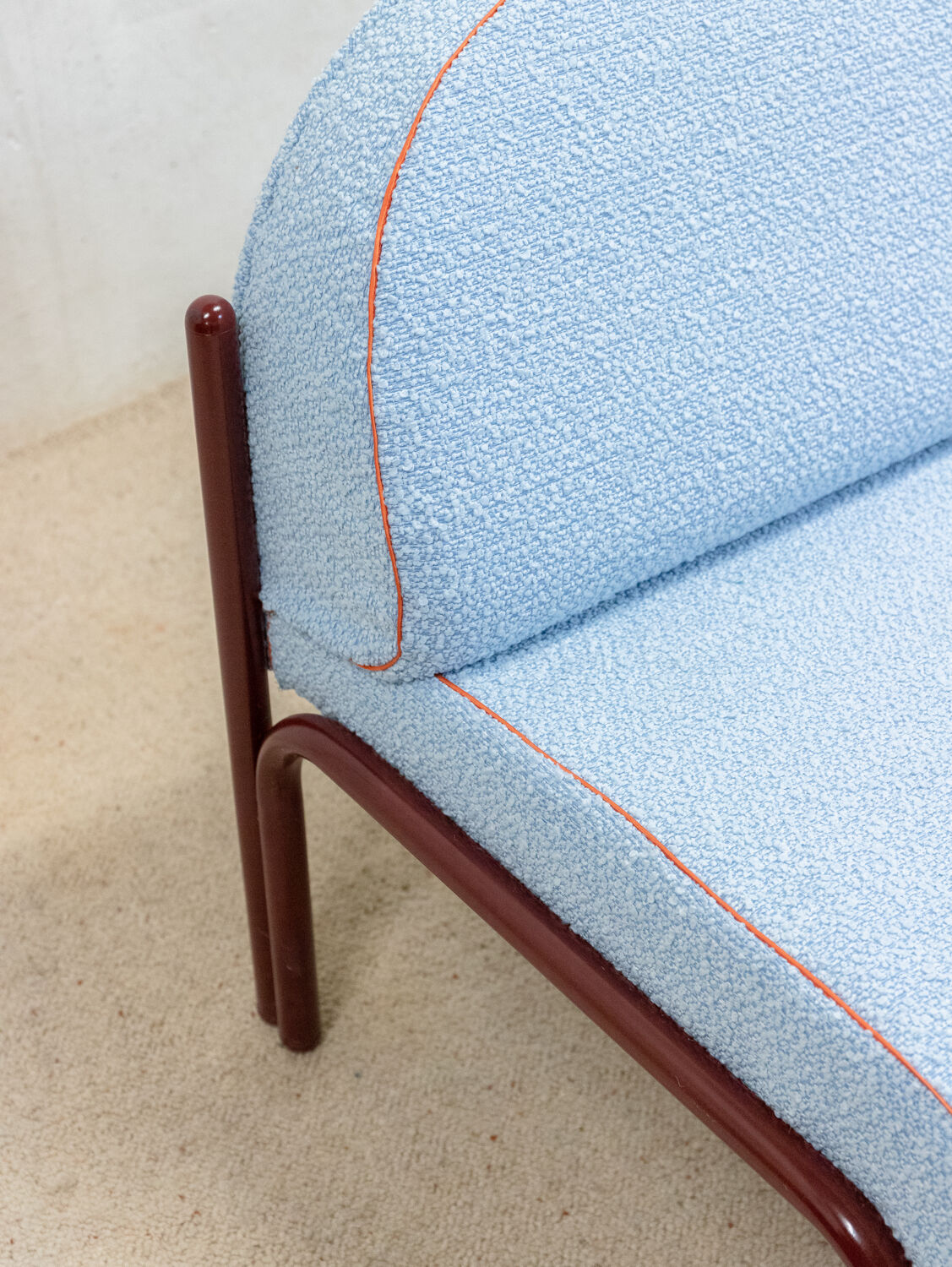 Souvignet armchair reupholstered in sky blue boucle.