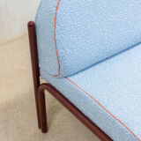 Souvignet armchair reupholstered in sky blue boucle.