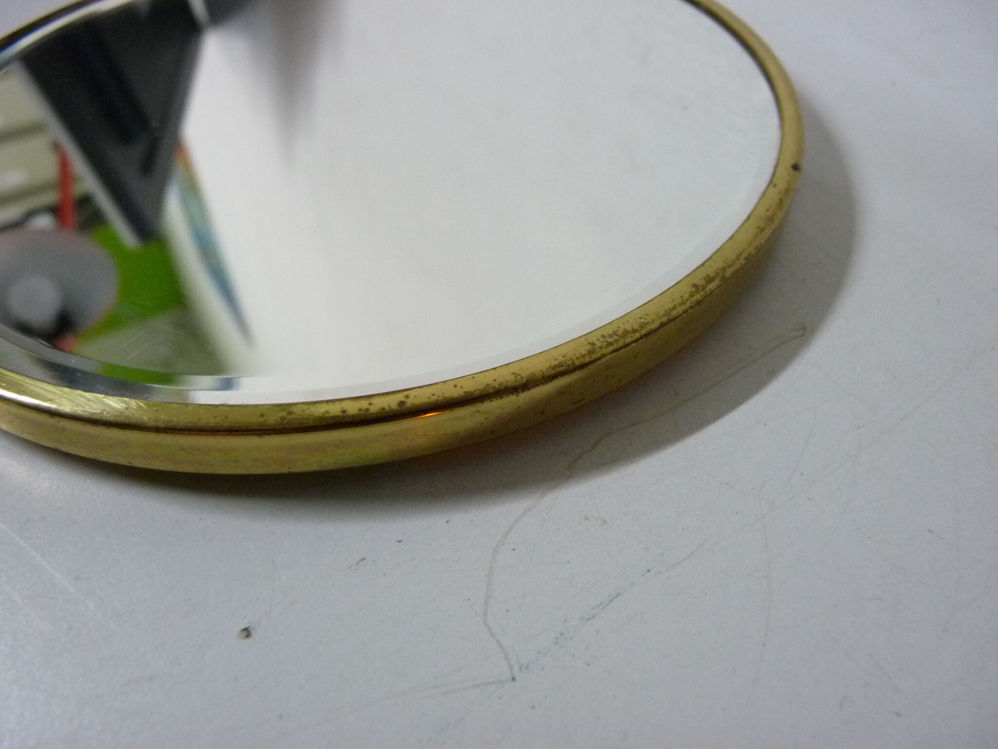 Old mirror double face with golden hand