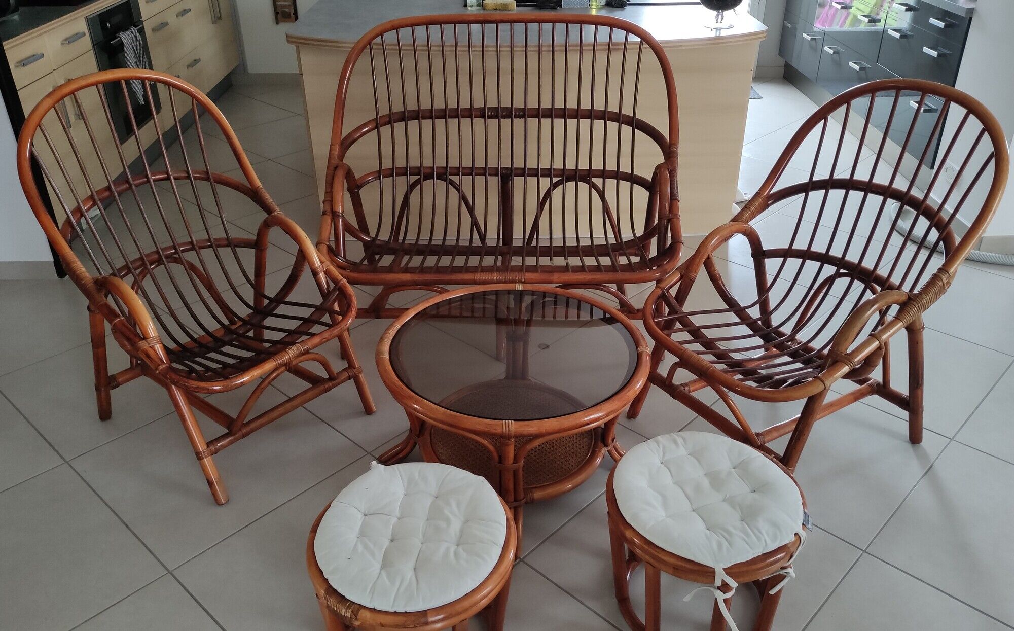 Sofa armchairs and coffee table in vintage rattan of six pieces