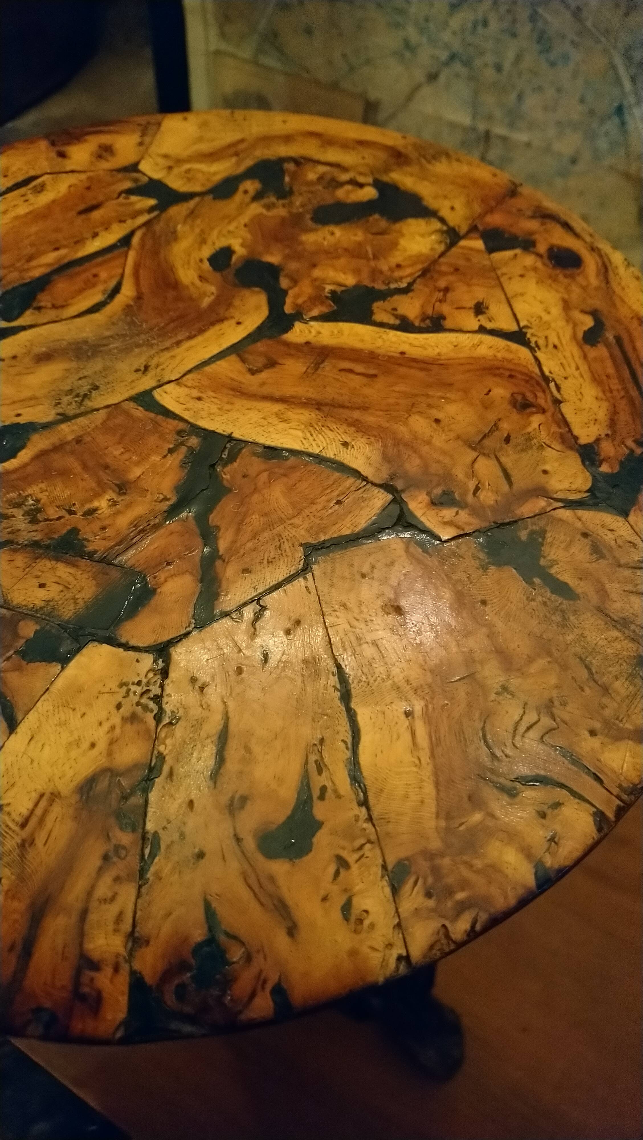 Brutalist tripod stool made from vine stumps.