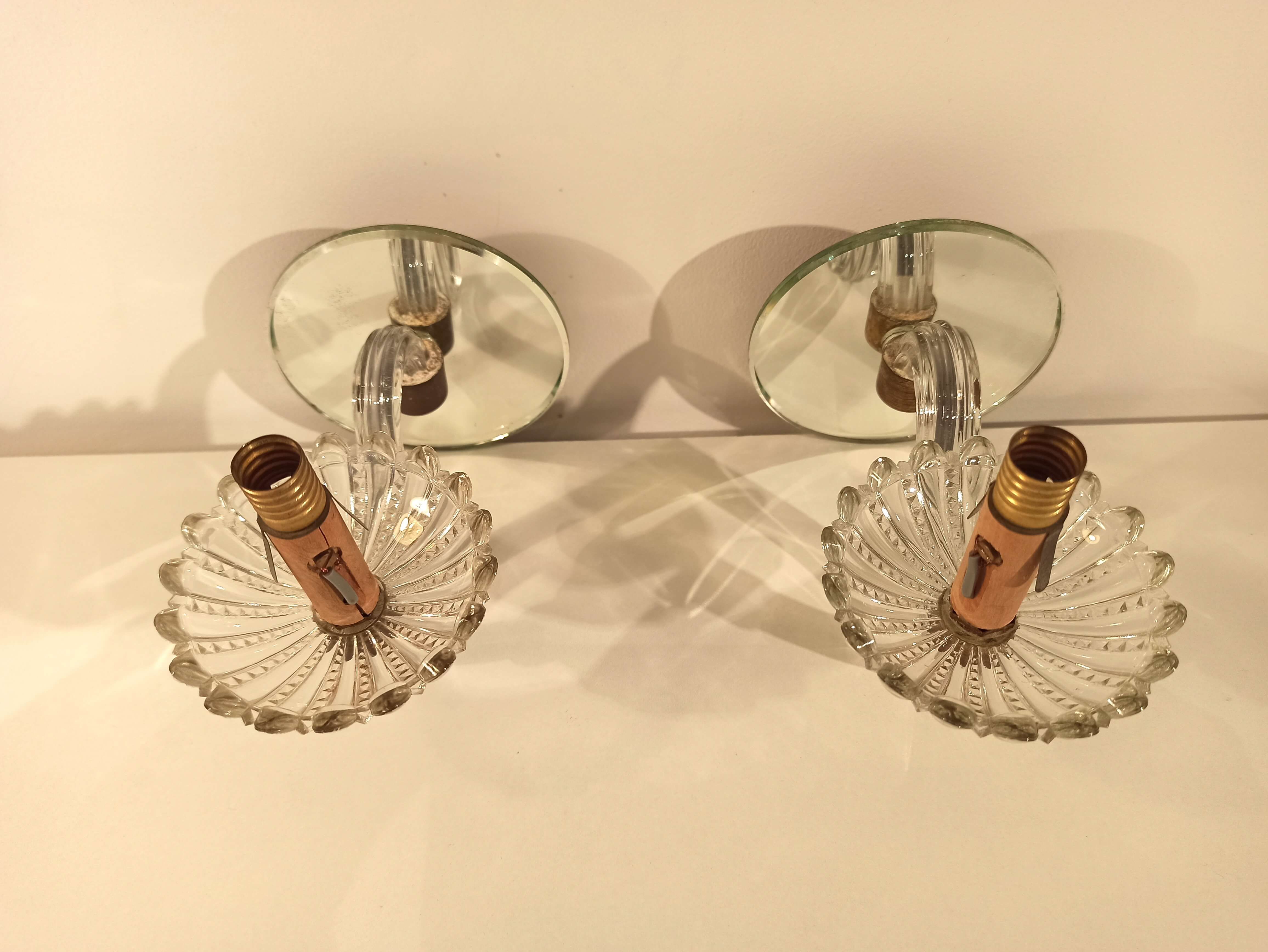 Pair of old glass  wall light and mirror vintage twisted arms