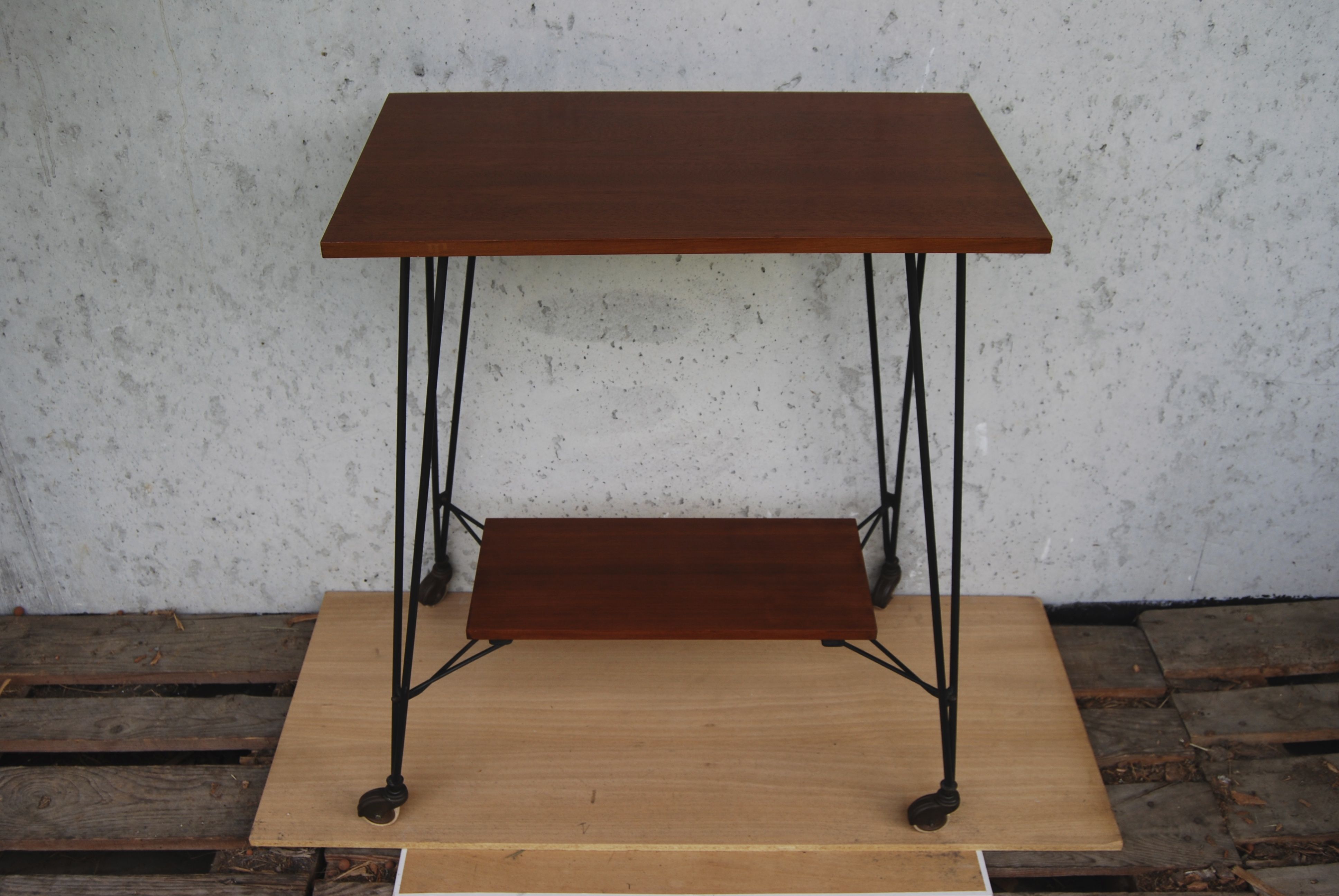 Tv furniture, a table with teak wheels and Scandinavian-style metal.