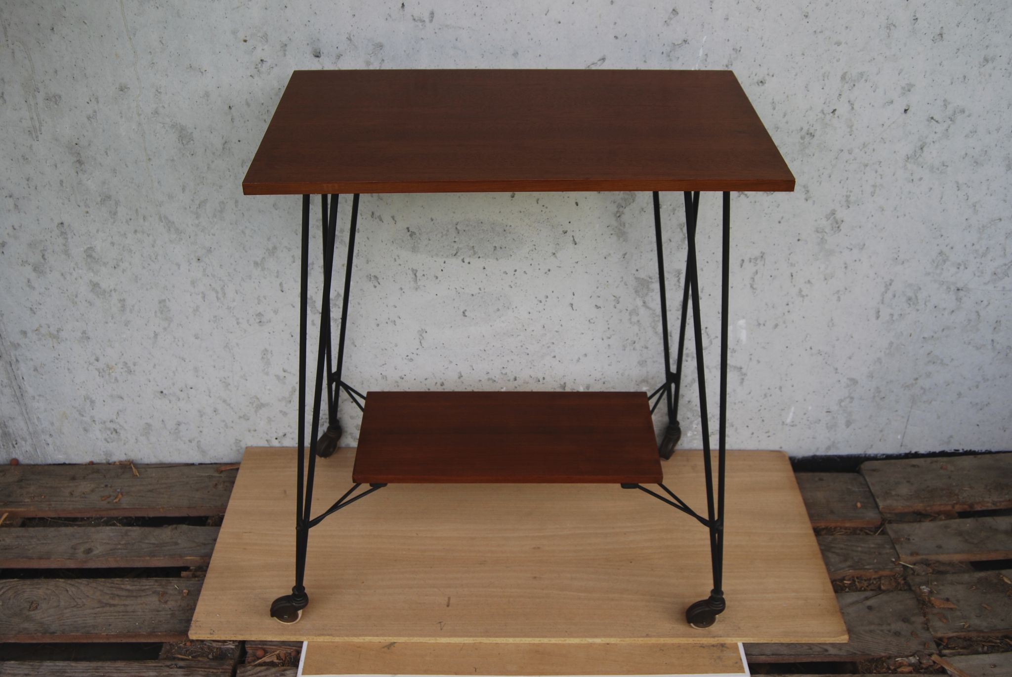 Tv furniture, a table with teak wheels and Scandinavian-style metal.
