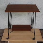 Tv furniture, a table with teak wheels and Scandinavian-style metal.