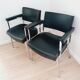 Pair of black skaï and chrome armchairs