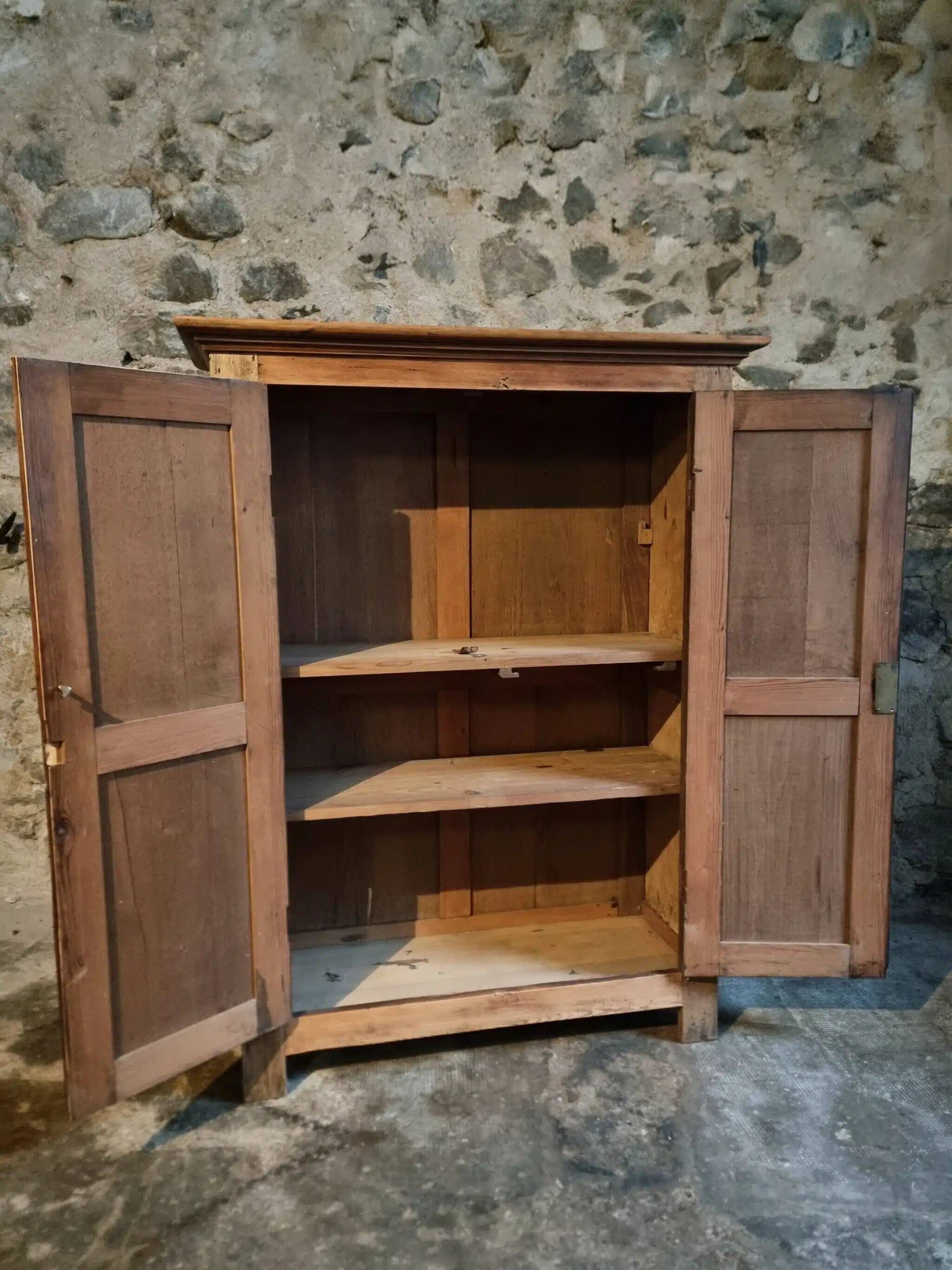 Antique French wardrobe in oak and pine, late 19th century.