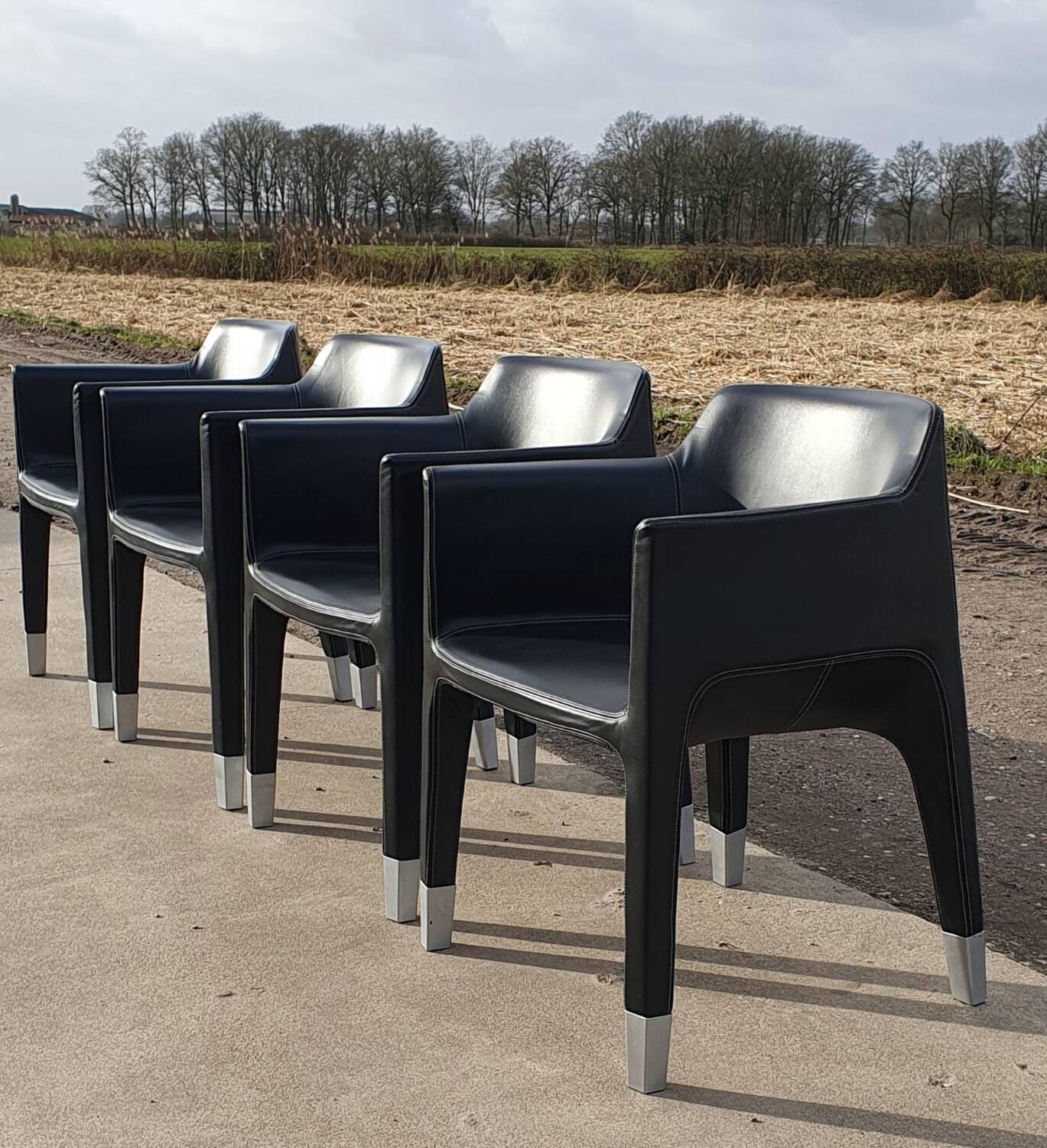 4 black armchairs Plank Claudio Bellini Mon Ami