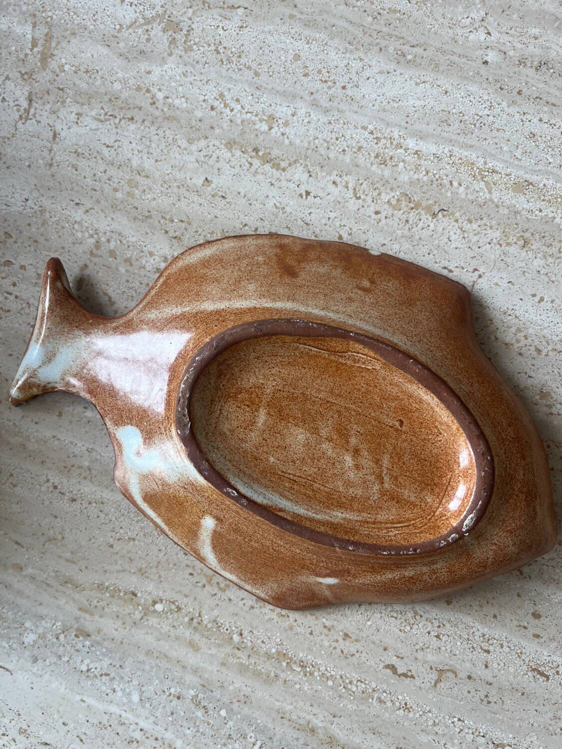 Decorative ceramic plate in the shape of a fish from the 1970s.