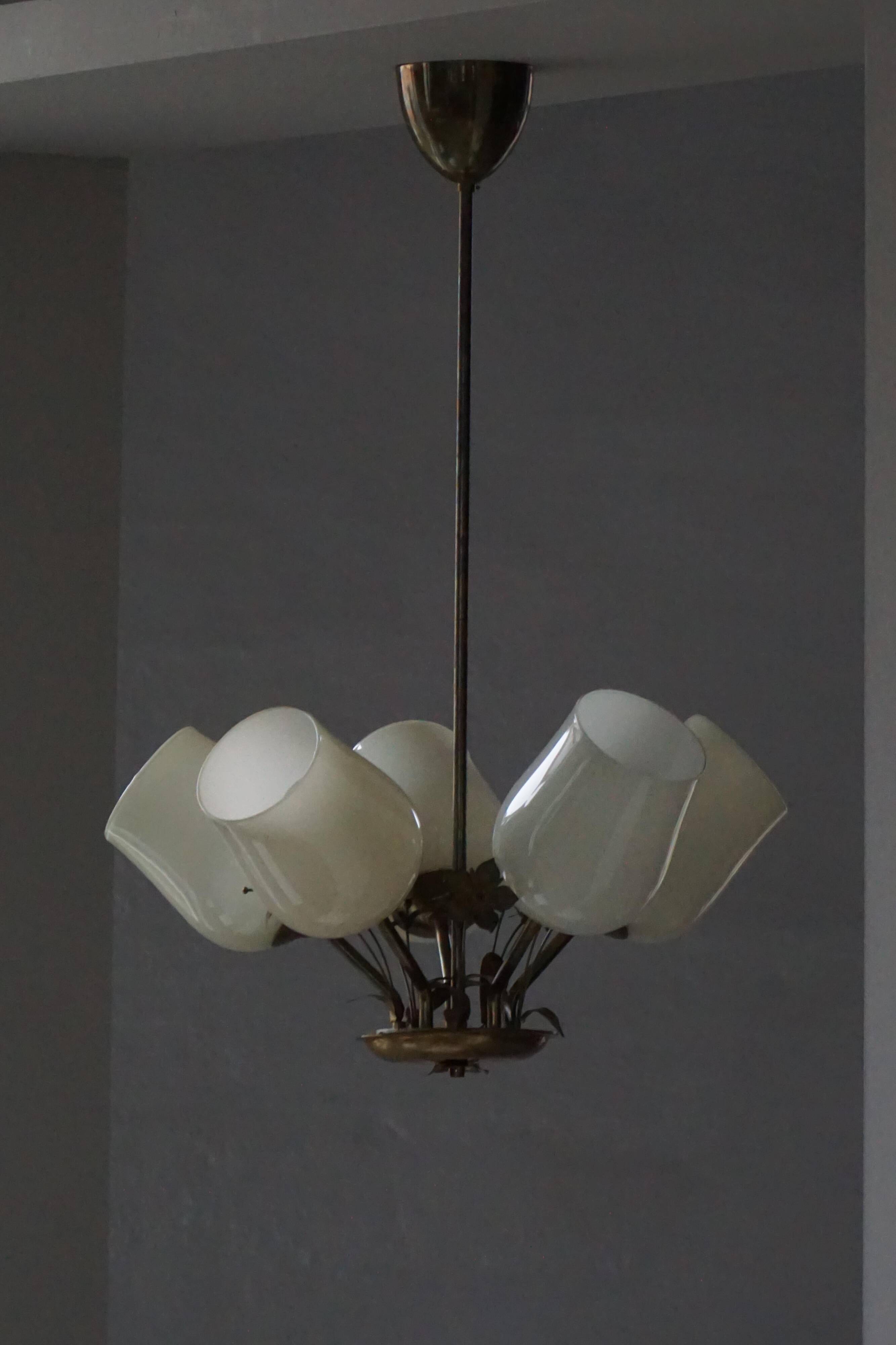 Five-branch brass and glass chandelier by Paavo Tynell for Idman OY Finland, 1940s.