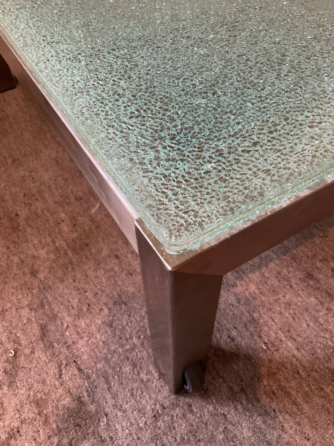 Designer garden coffee table in tempered glass and stainless steel